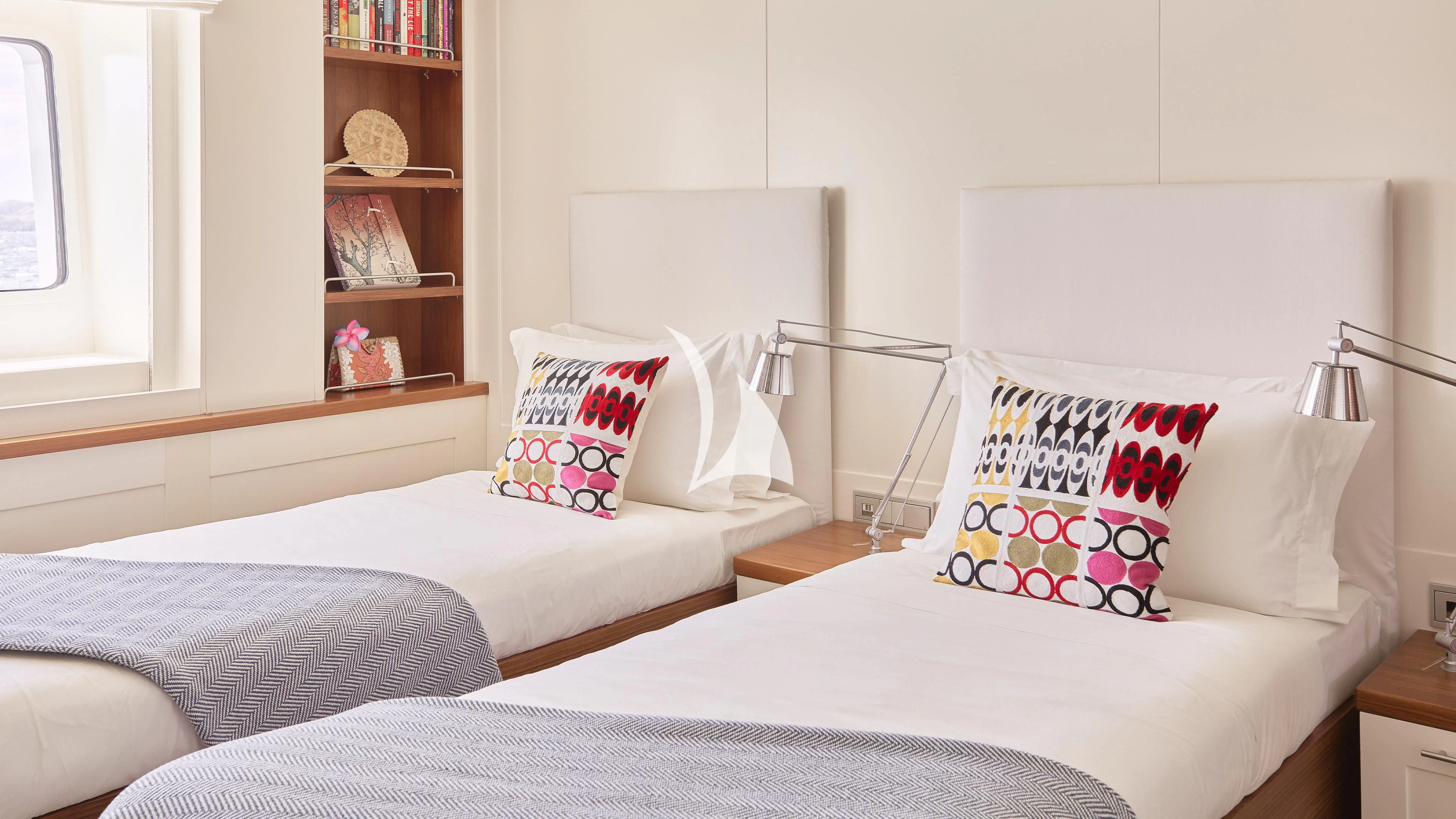 a couple of beds in a room aboard SENSES Yacht for Sale