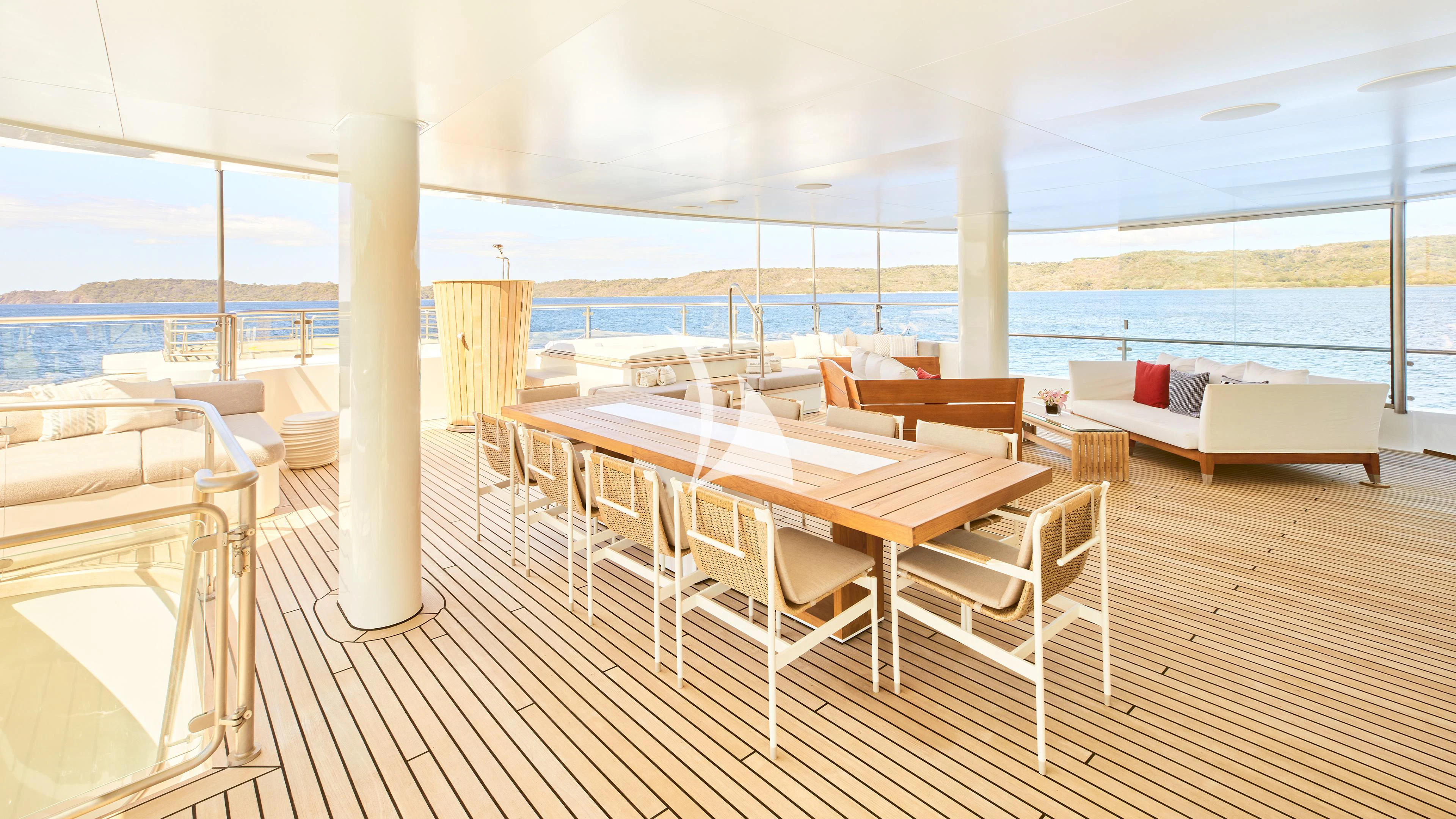 a room with tables and chairs aboard SENSES Yacht for Sale