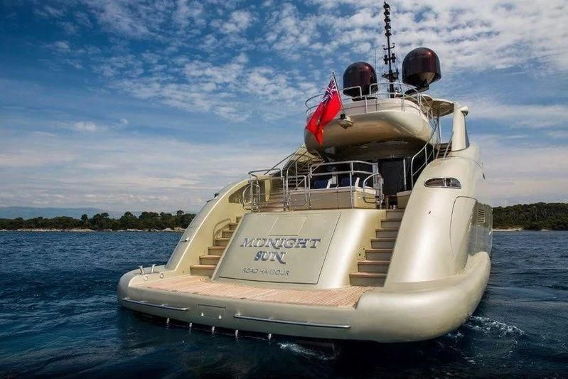 a white boat on the water aboard YCM 120 Yacht for Charter