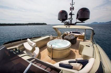 a boat with a large pot on it aboard YCM 120 Yacht for Charter