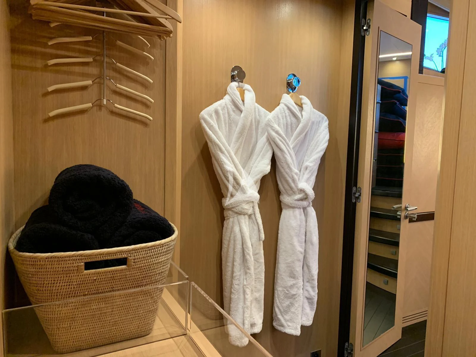 a basket with clothes on a wall aboard YCM 120 Yacht for Charter