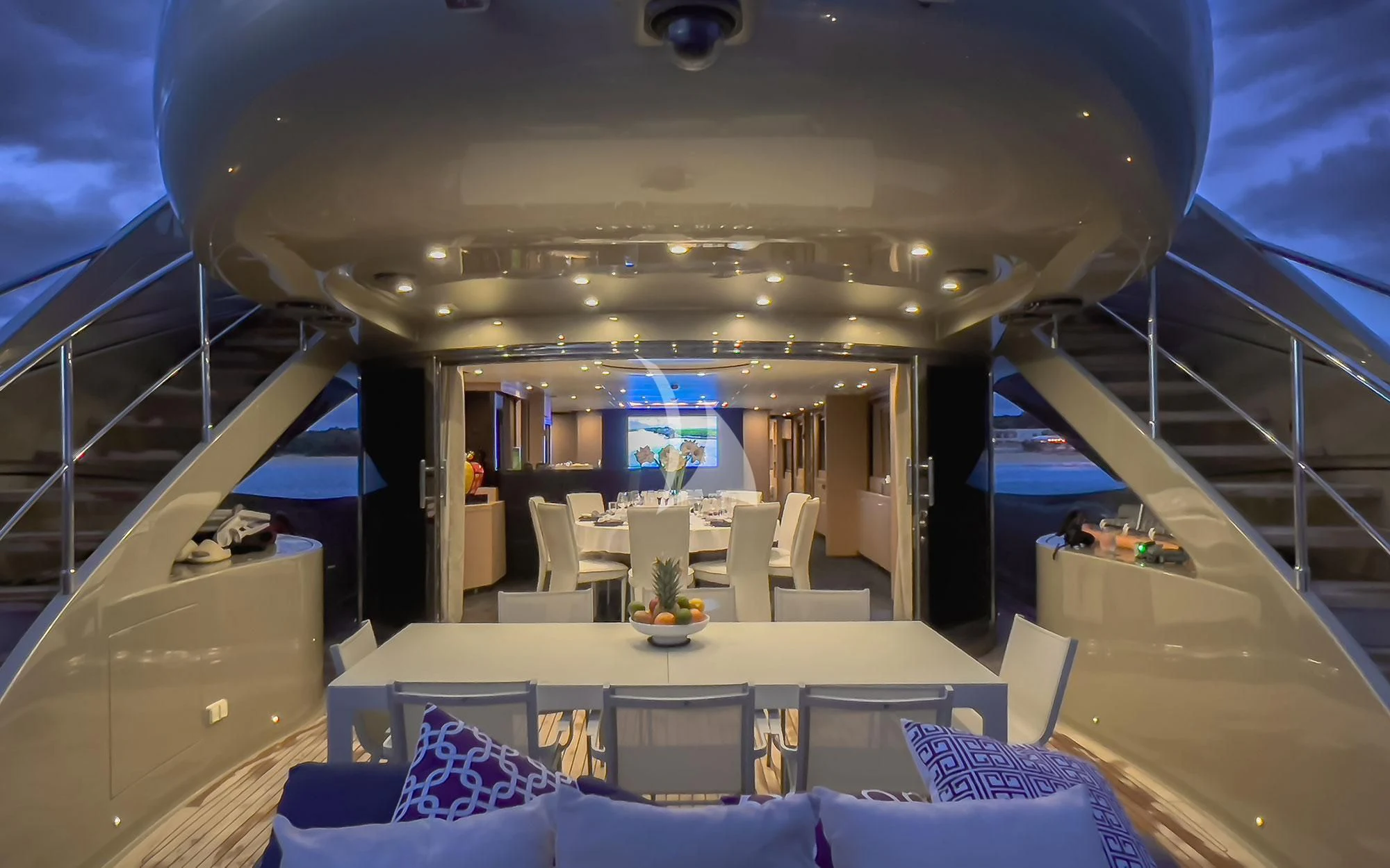 inside of a building with a staircase and a glass ceiling aboard YCM 120 Yacht for Charter