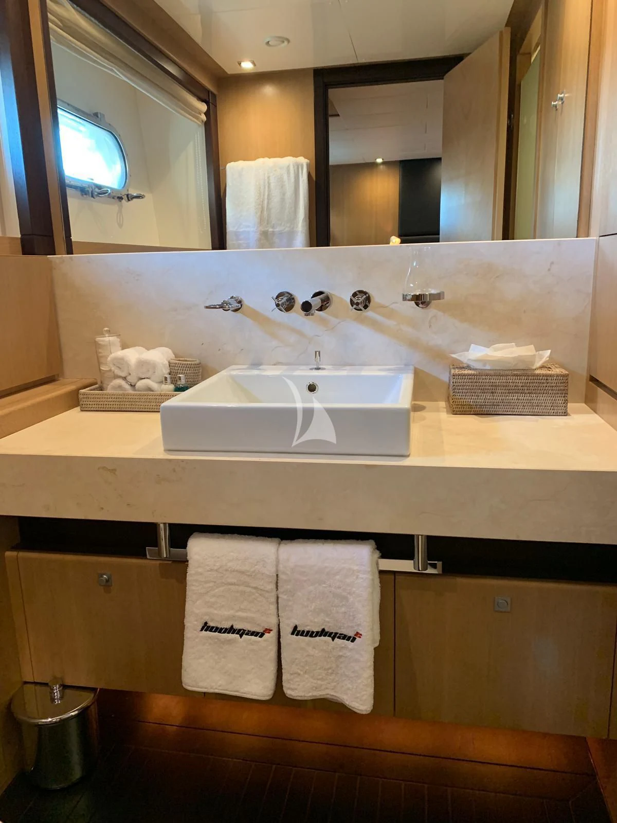 a bathroom with a large mirror aboard YCM 120 Yacht for Charter