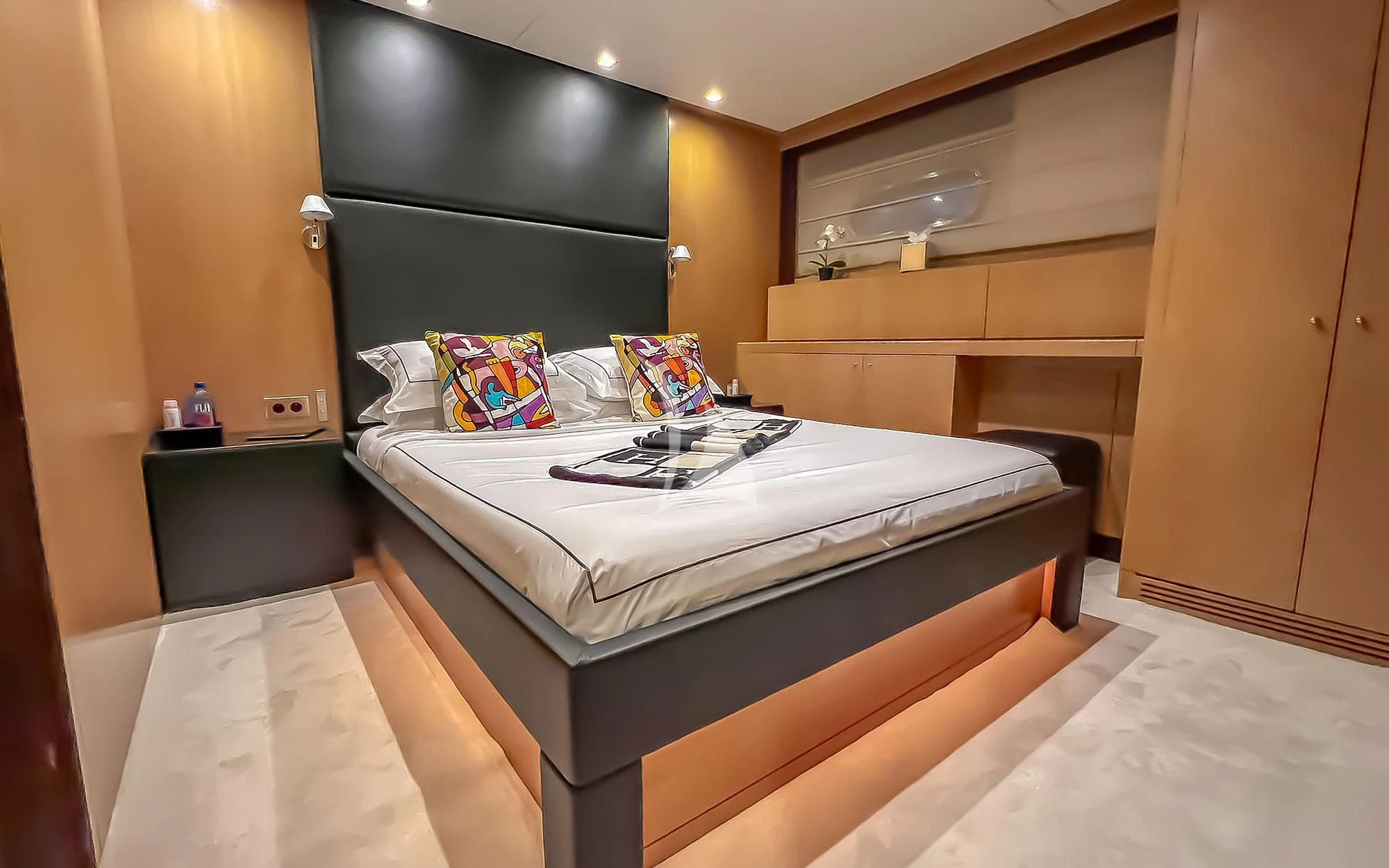 a bed in a room aboard YCM 120 Yacht for Charter