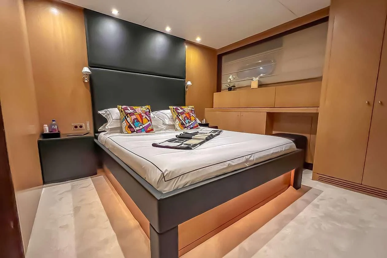 a bed in a room aboard YCM 120 Yacht for Charter