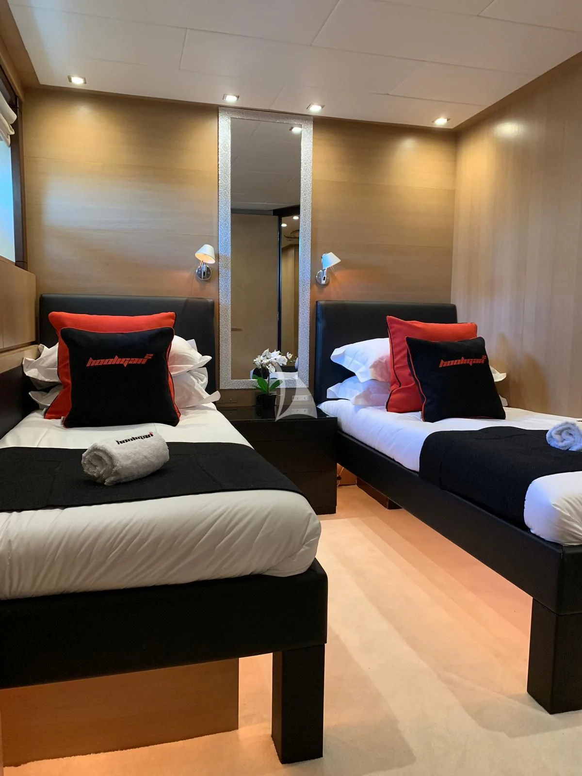 a room with two beds aboard YCM 120 Yacht for Charter