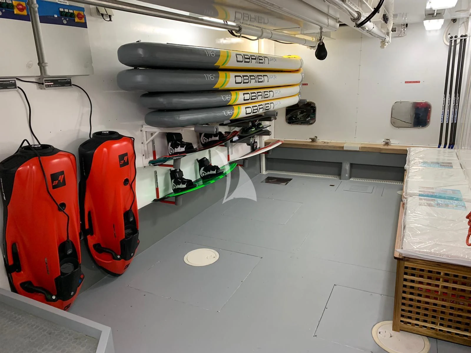 a room with equipment and boxes aboard YCM 120 Yacht for Charter