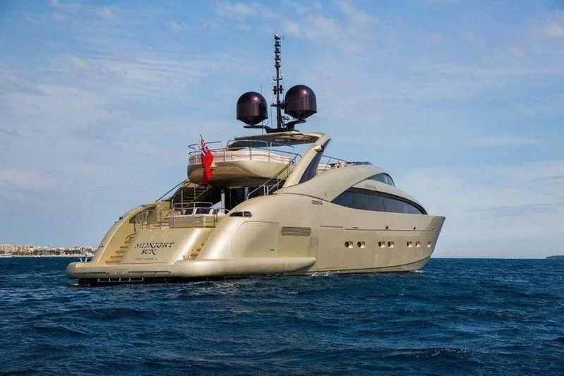 a white boat in the water aboard YCM 120 Yacht for Charter