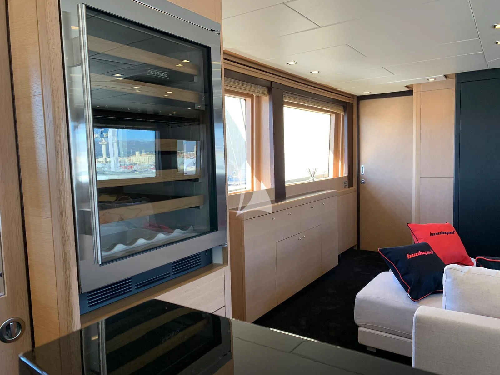 a room with a bed and a large glass door aboard YCM 120 Yacht for Charter