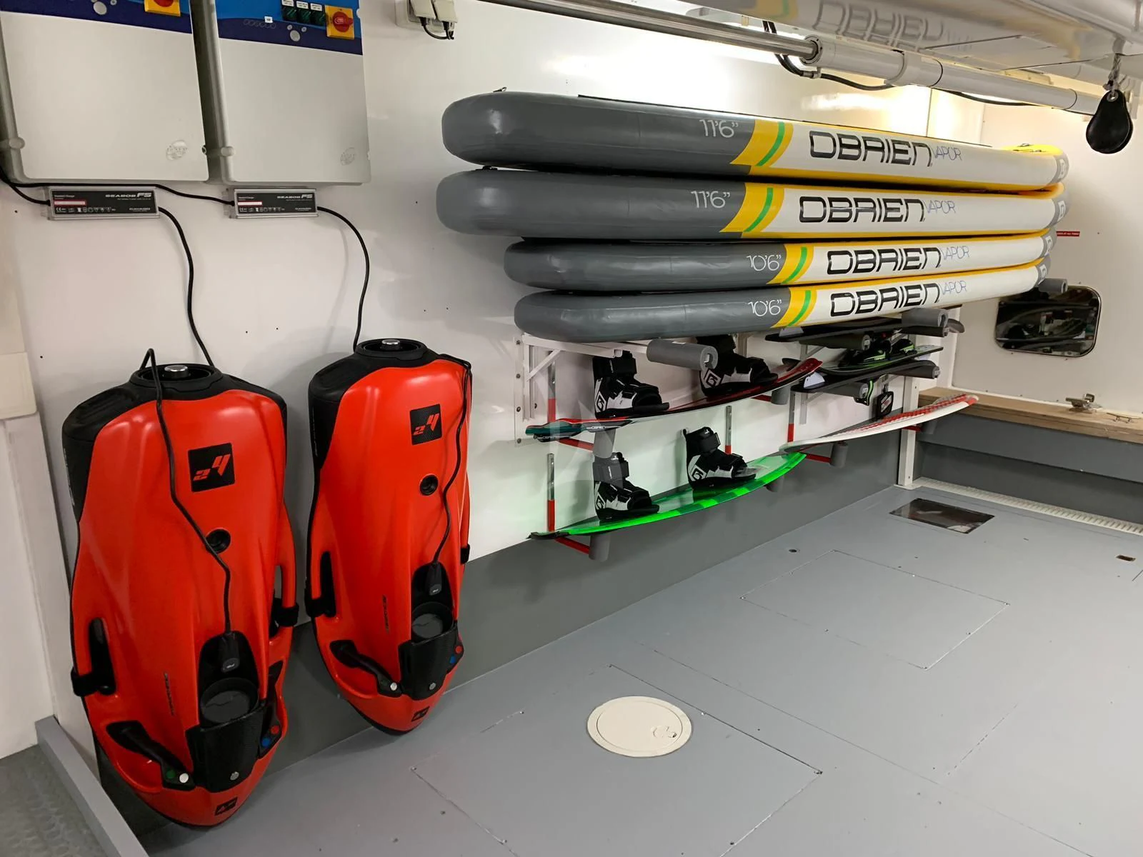 a red suitcase next to a white machine aboard YCM 120 Yacht for Charter