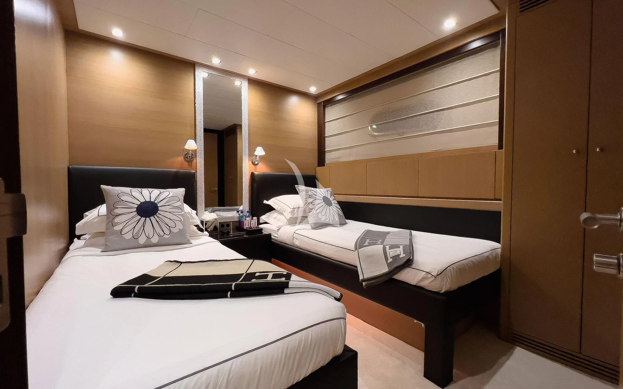 a couple of beds in a hotel room aboard YCM 120 Yacht for Charter