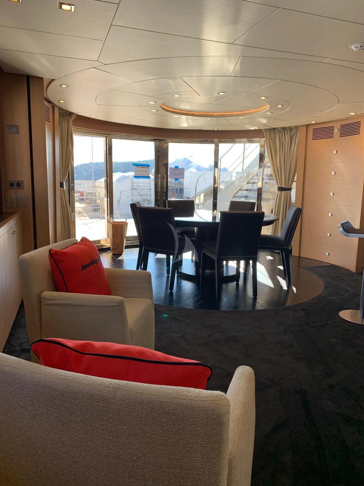 a room with a table and chairs aboard YCM 120 Yacht for Charter