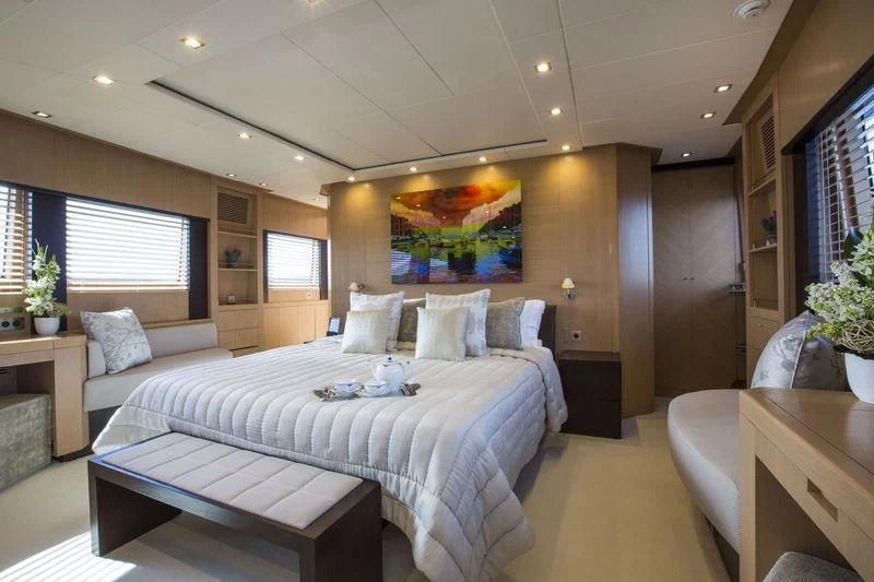 a large bedroom with a large bed aboard YCM 120 Yacht for Charter