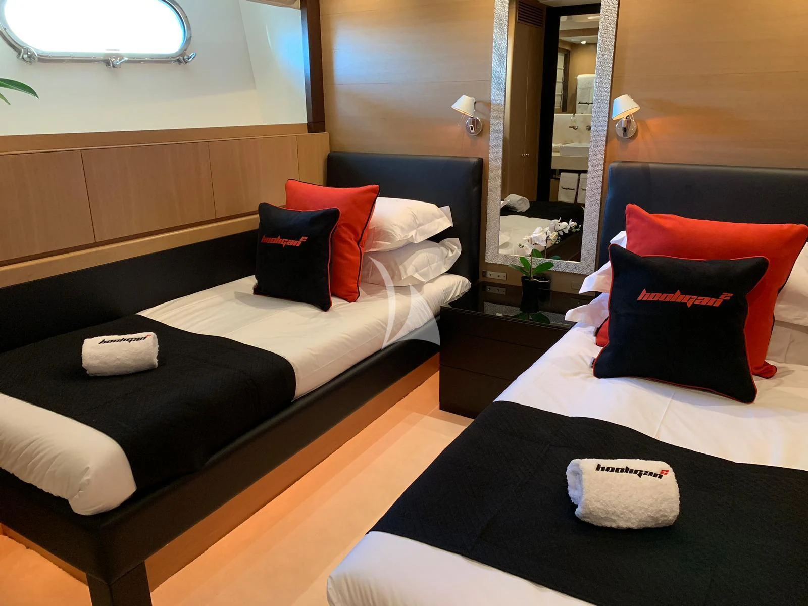 a room with a bed and a mirror aboard YCM 120 Yacht for Charter