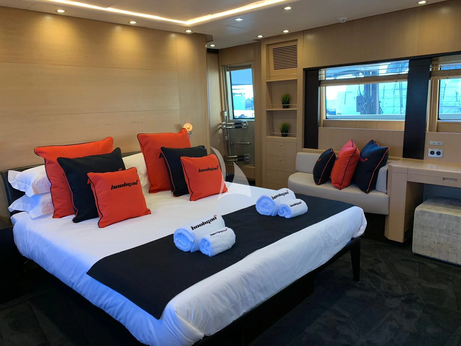 a bed with pillows and pillows aboard YCM 120 Yacht for Charter