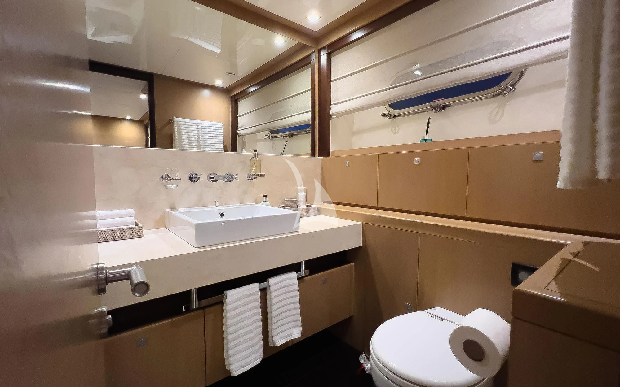 a bathroom with a sink and toilet aboard YCM 120 Yacht for Charter