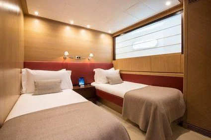 a room with two beds aboard YCM 120 Yacht for Charter