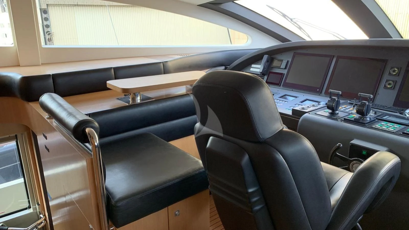 a room with a desk and computer aboard YCM 120 Yacht for Charter