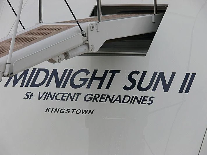 a boat with a sign aboard YCM 120 Yacht for Charter
