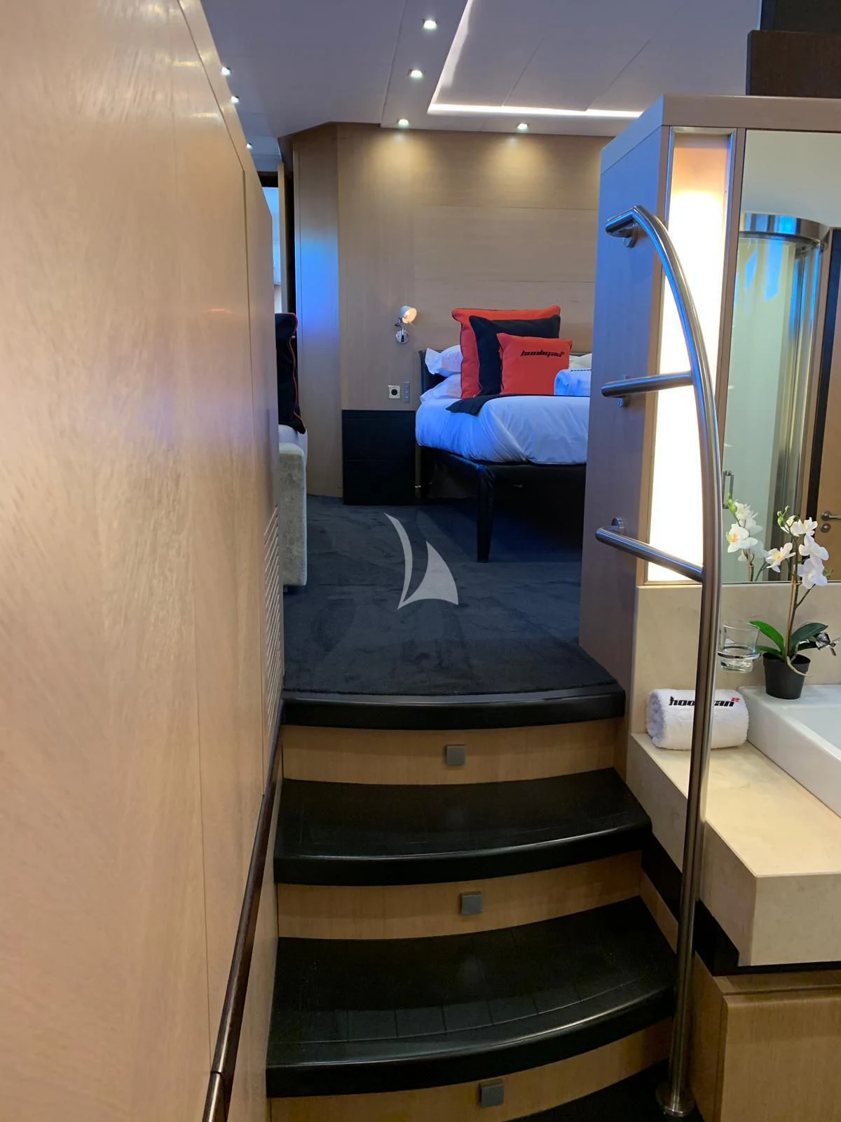 a bathroom with a bed and a mirror aboard YCM 120 Yacht for Charter