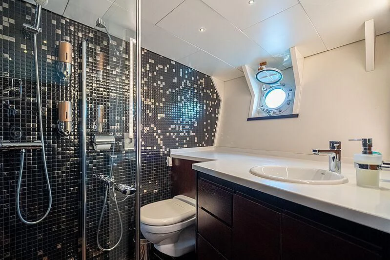 a bathroom with a glass shower aboard SEMAYA Yacht for Sale