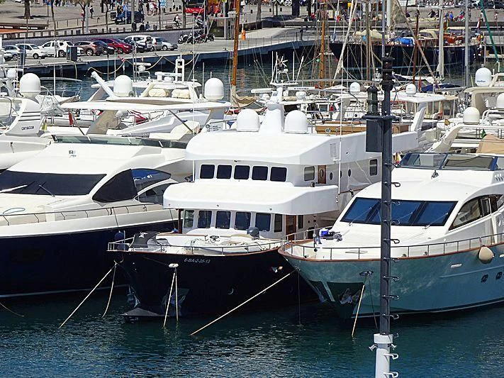 several boats docked at a pier aboard SEMAYA Yacht for Sale
