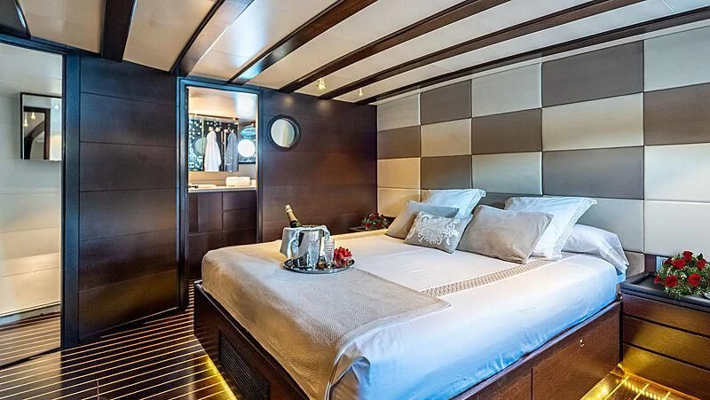 a bed with a tray on it aboard SEMAYA Yacht for Sale