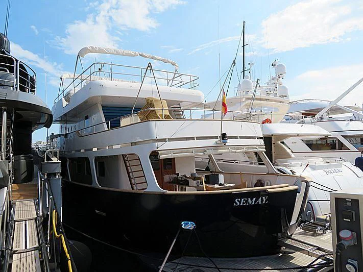 a large white boat sits in a dock aboard SEMAYA Yacht for Sale