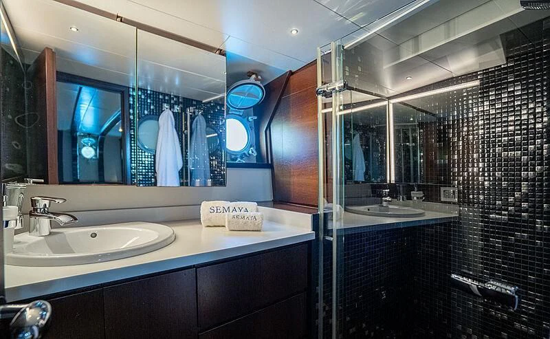 a bathroom with a large mirror aboard SEMAYA Yacht for Sale