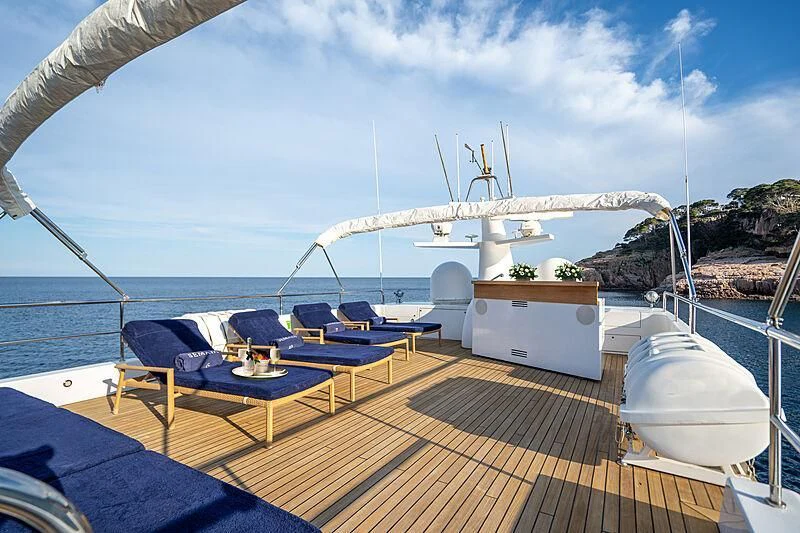 a deck with a large ship in the background aboard SEMAYA Yacht for Sale