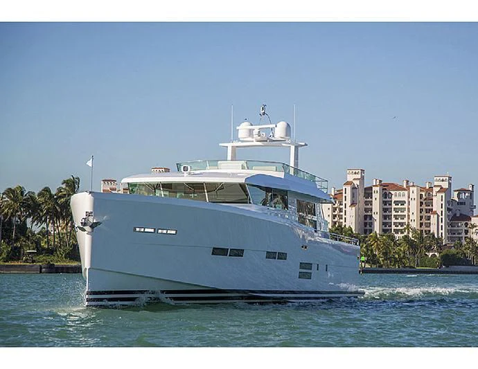 a large white boat on the water aboard SOCIAL DISTANCING Yacht for Sale