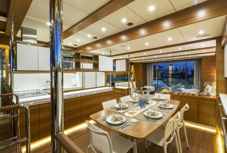 a dining room with a table and chairs aboard SOCIAL DISTANCING Yacht for Sale