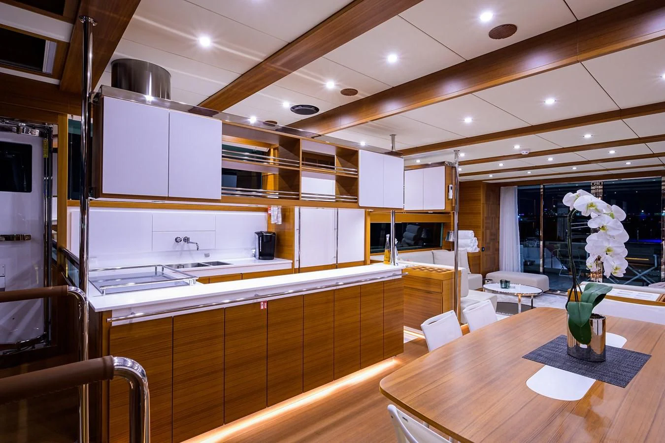 a kitchen with a table and cabinets aboard SOCIAL DISTANCING Yacht for Sale