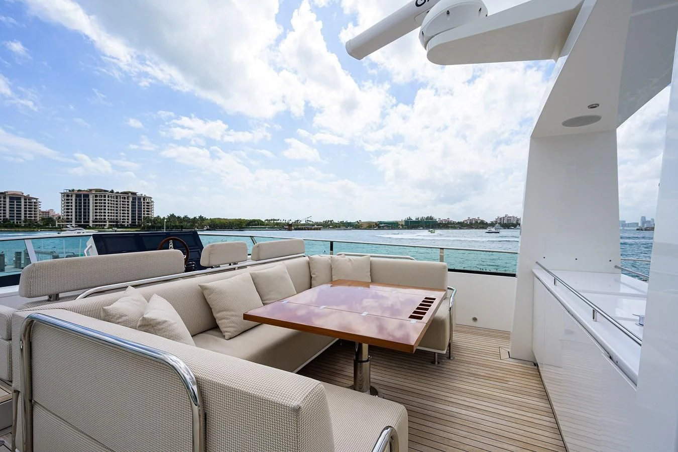 a room with a couch and a table and chairs on a deck aboard SOCIAL DISTANCING Yacht for Sale