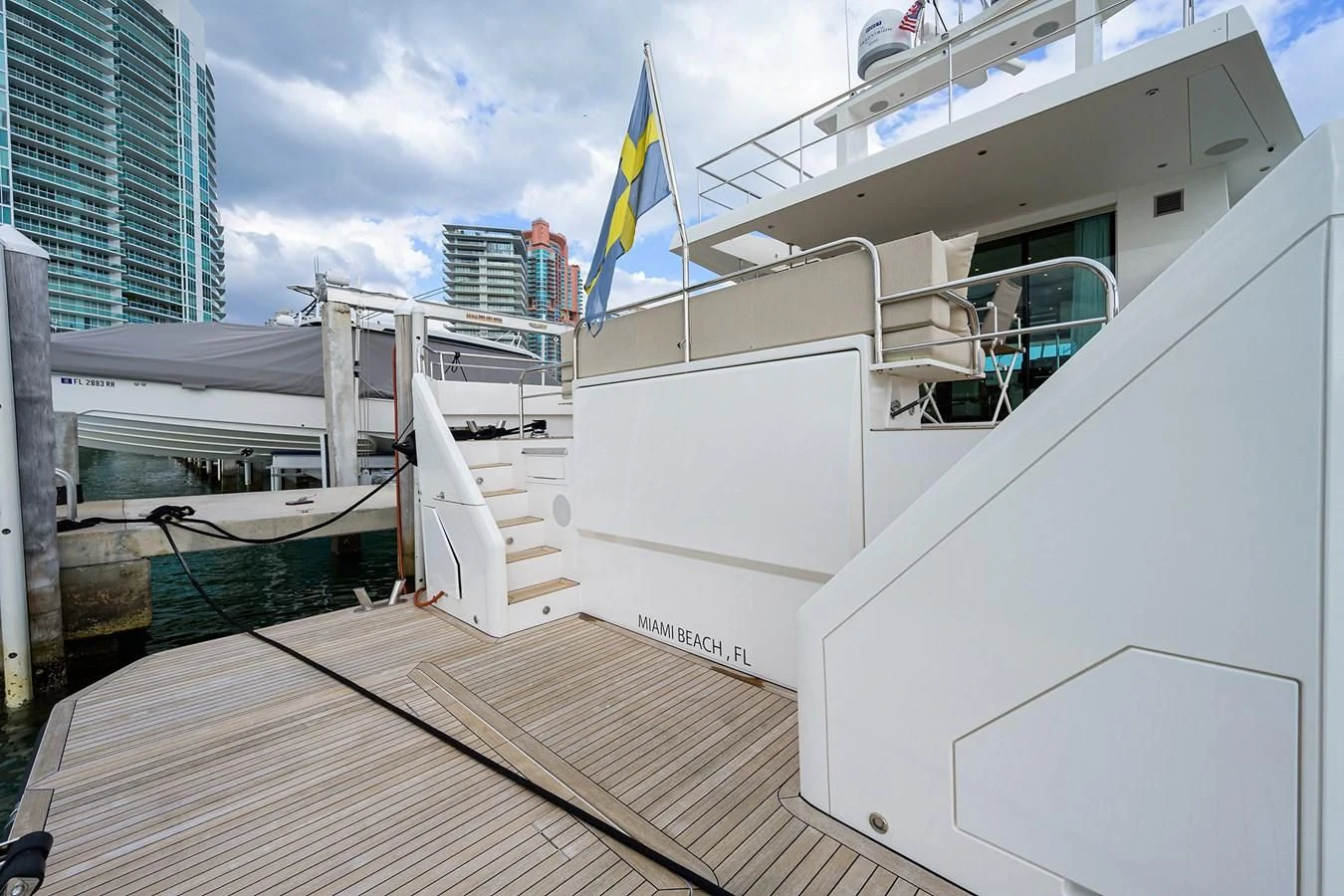 a white building with a flag on the roof aboard SOCIAL DISTANCING Yacht for Sale