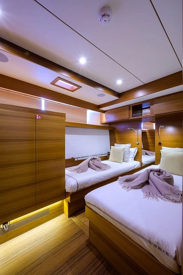 a room with a couple of beds aboard SOCIAL DISTANCING Yacht for Sale