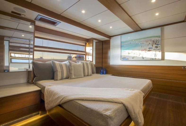 a room with a bed and a tv on the wall aboard SOCIAL DISTANCING Yacht for Sale
