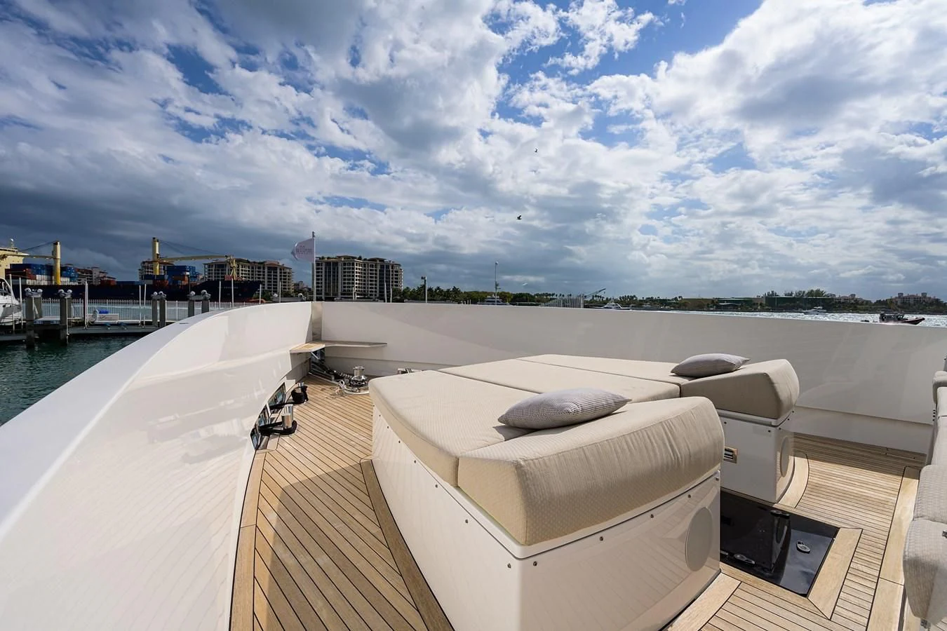 a lounge chair on a deck overlooking a body of water aboard SOCIAL DISTANCING Yacht for Sale