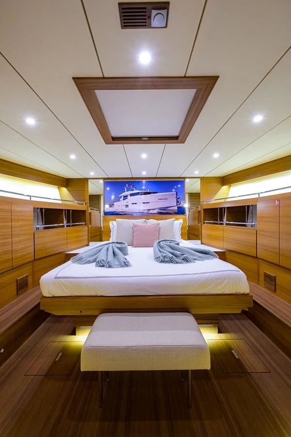 a room with a bed and a tv aboard SOCIAL DISTANCING Yacht for Sale