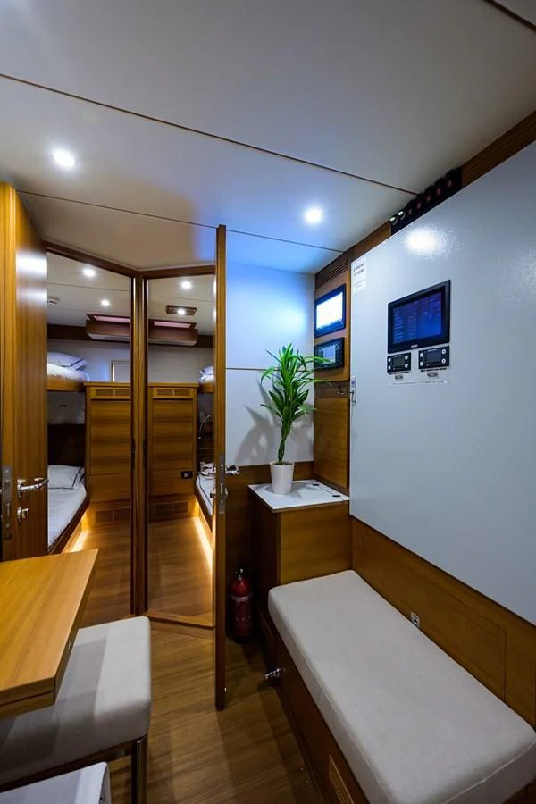 a room with a bed and a mirror aboard SOCIAL DISTANCING Yacht for Sale