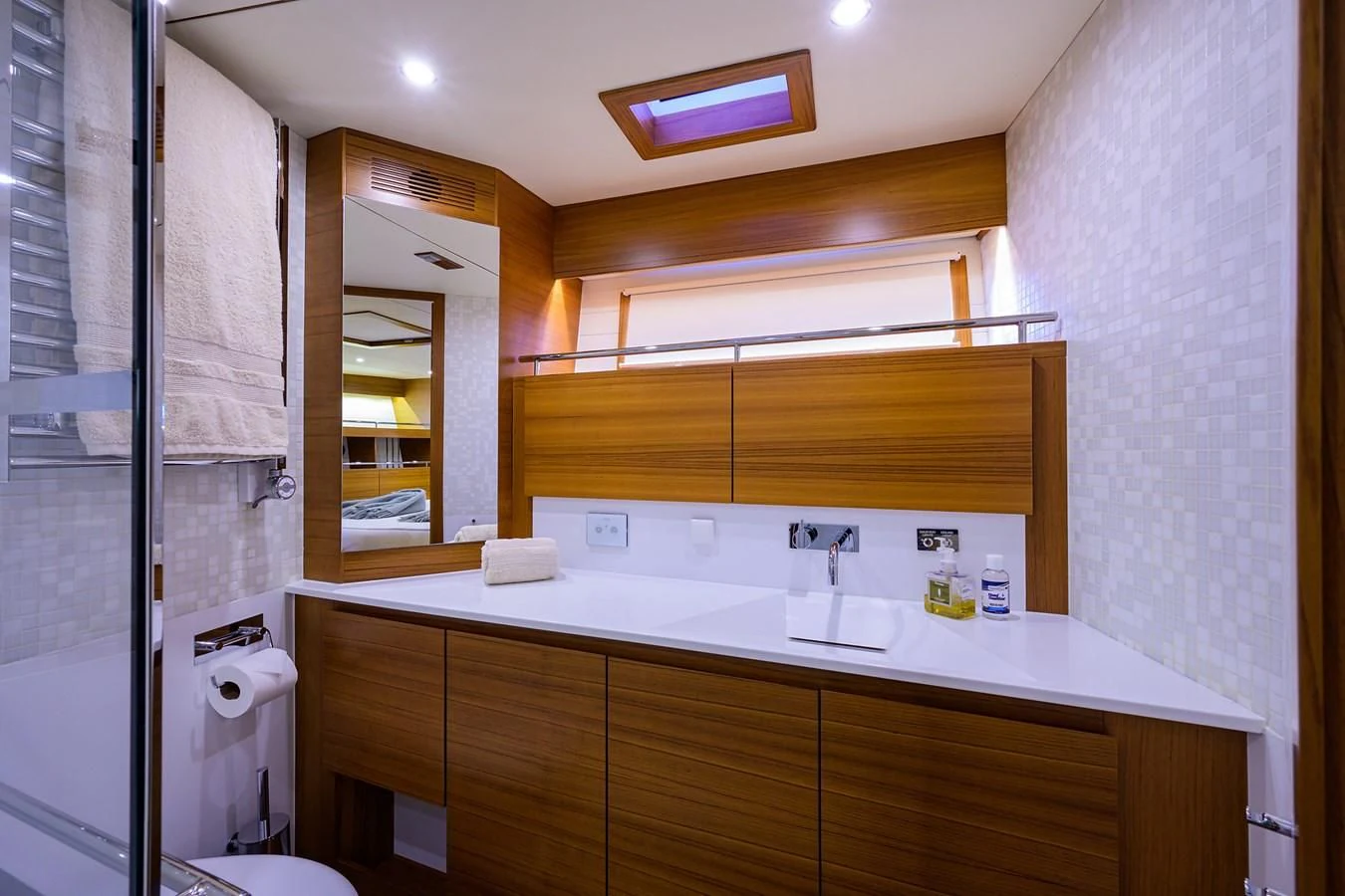 a bathroom with a sink and a mirror aboard SOCIAL DISTANCING Yacht for Sale