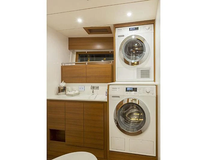 a washer and dryer in a kitchen aboard SOCIAL DISTANCING Yacht for Sale