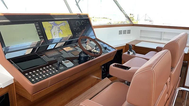 a boat with a computer and a chair aboard SOCIAL DISTANCING Yacht for Sale