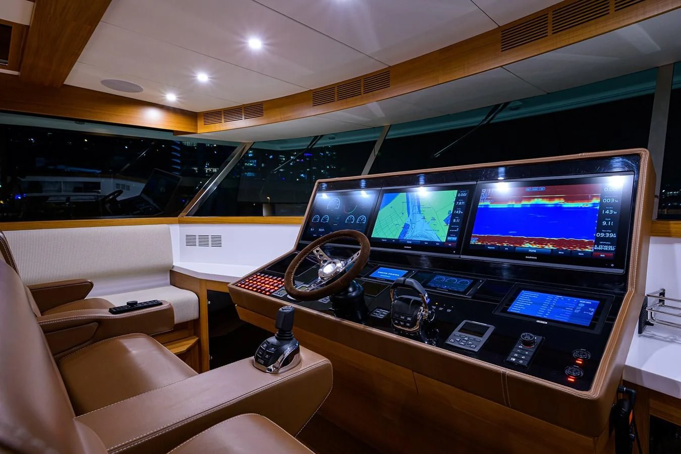 a room with a large television and a table with chairs aboard SOCIAL DISTANCING Yacht for Sale