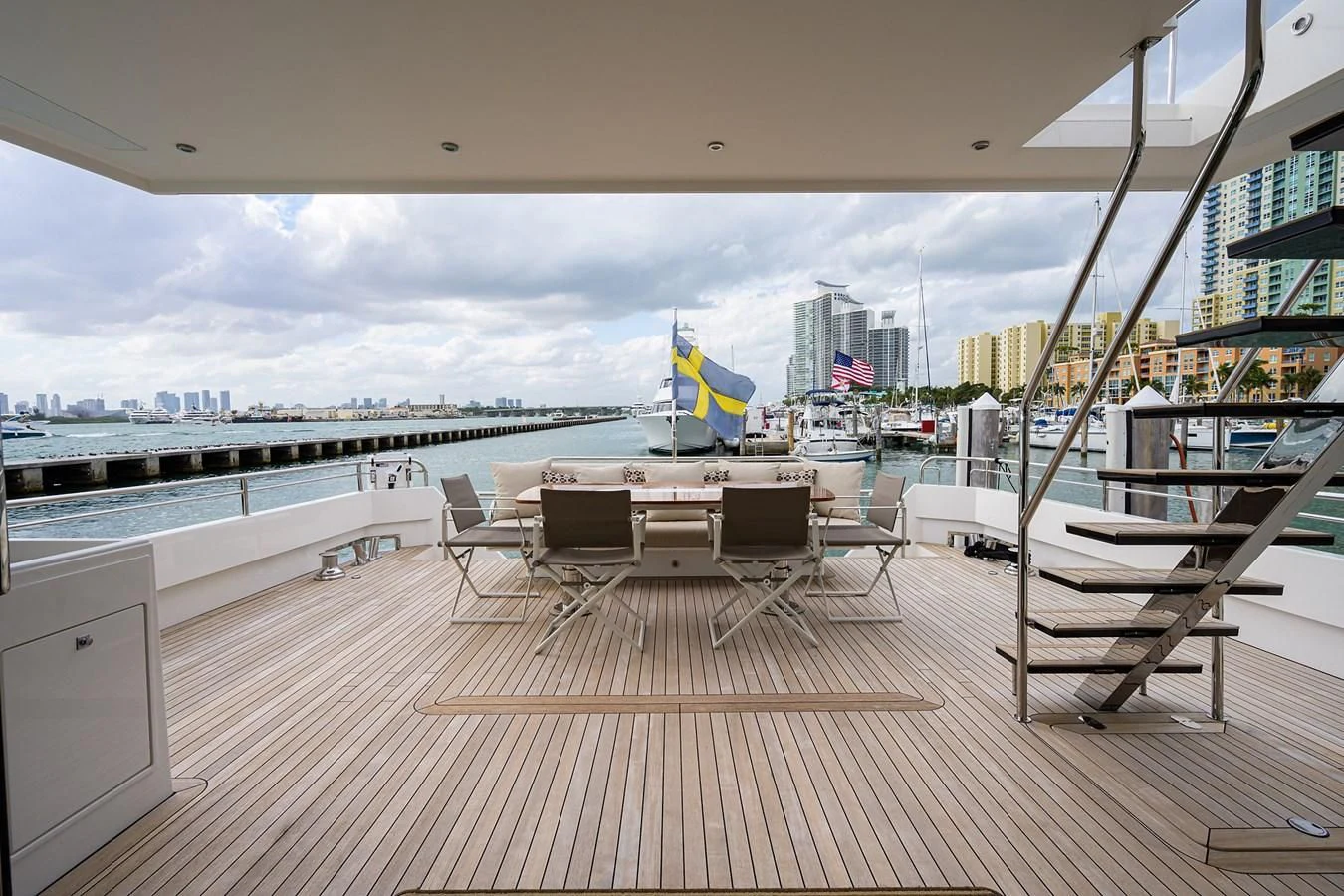 a deck with a view of a city and water aboard SOCIAL DISTANCING Yacht for Sale