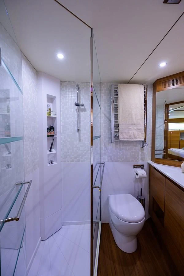 a bathroom with a glass shower aboard SOCIAL DISTANCING Yacht for Sale