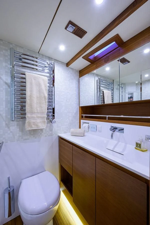 a bathroom with a toilet and a sink aboard SOCIAL DISTANCING Yacht for Sale