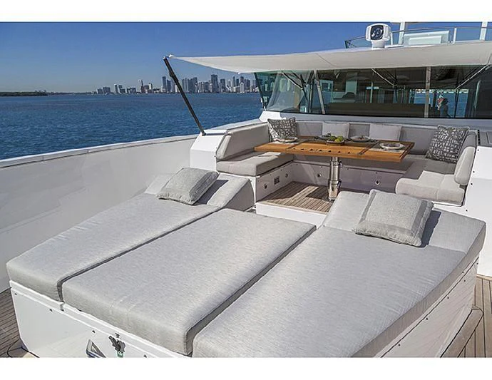 a room with a couch and a table and a pool aboard SOCIAL DISTANCING Yacht for Sale