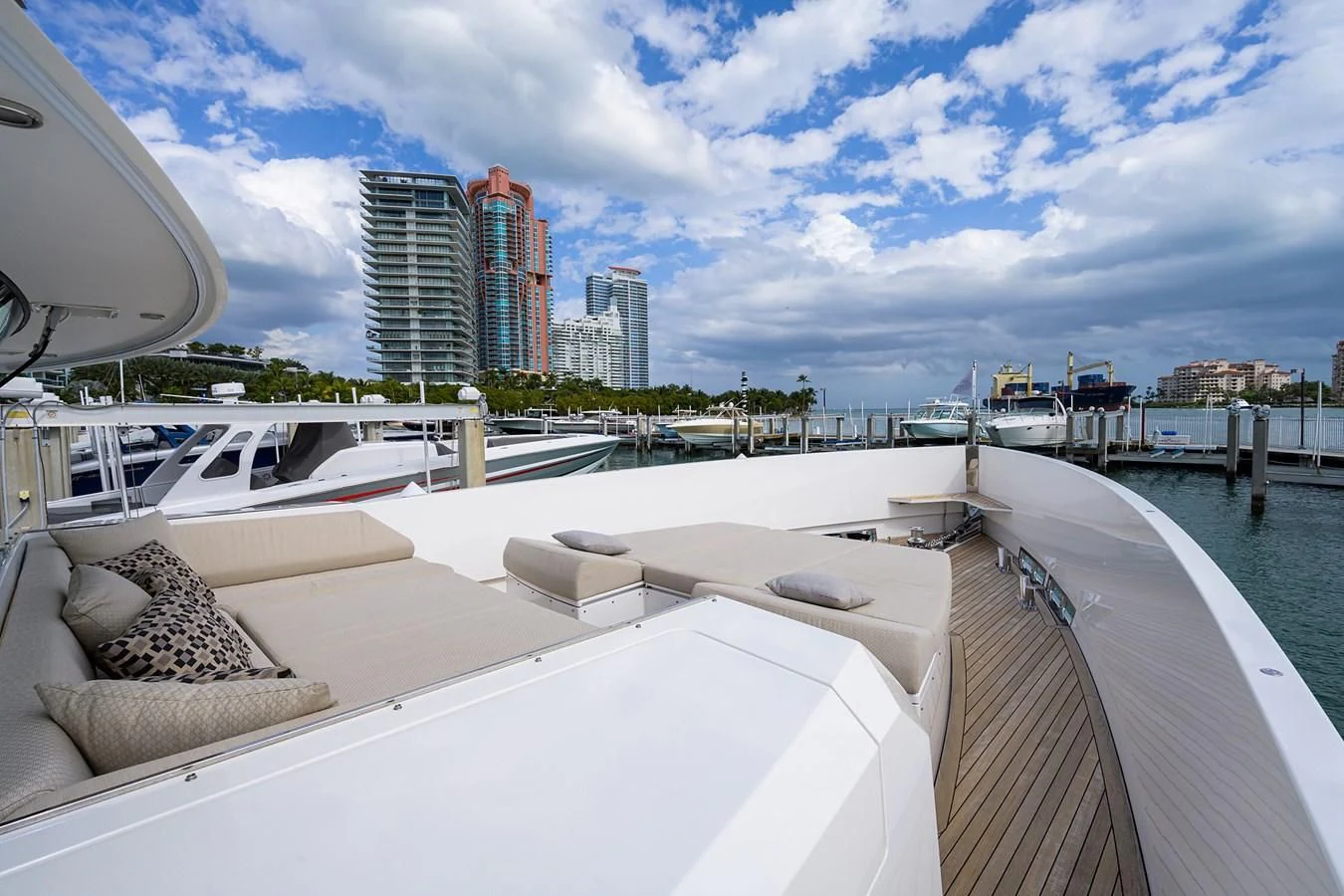 a deck with a view of a city and a body of water aboard SOCIAL DISTANCING Yacht for Sale