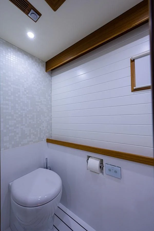 a toilet in a bathroom aboard SOCIAL DISTANCING Yacht for Sale